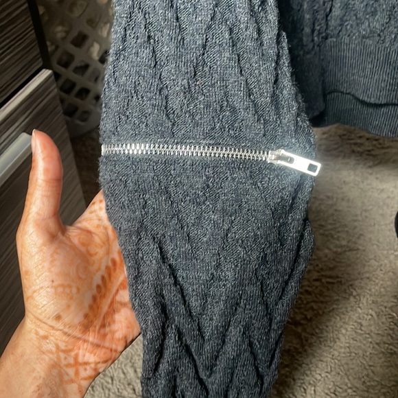 This is a light weight sweatshirt piece. It has zipper sleeves. - Picture 2 of 2